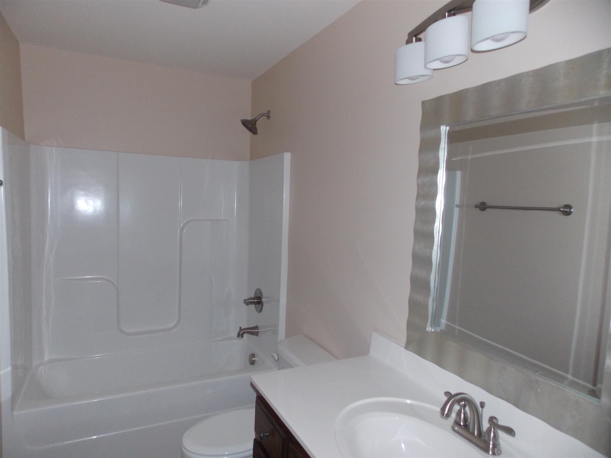 400 Goshen Road Lebanon, TN 37087 - Photo 12 of 20 a bathroom with a sink a toilet and shower