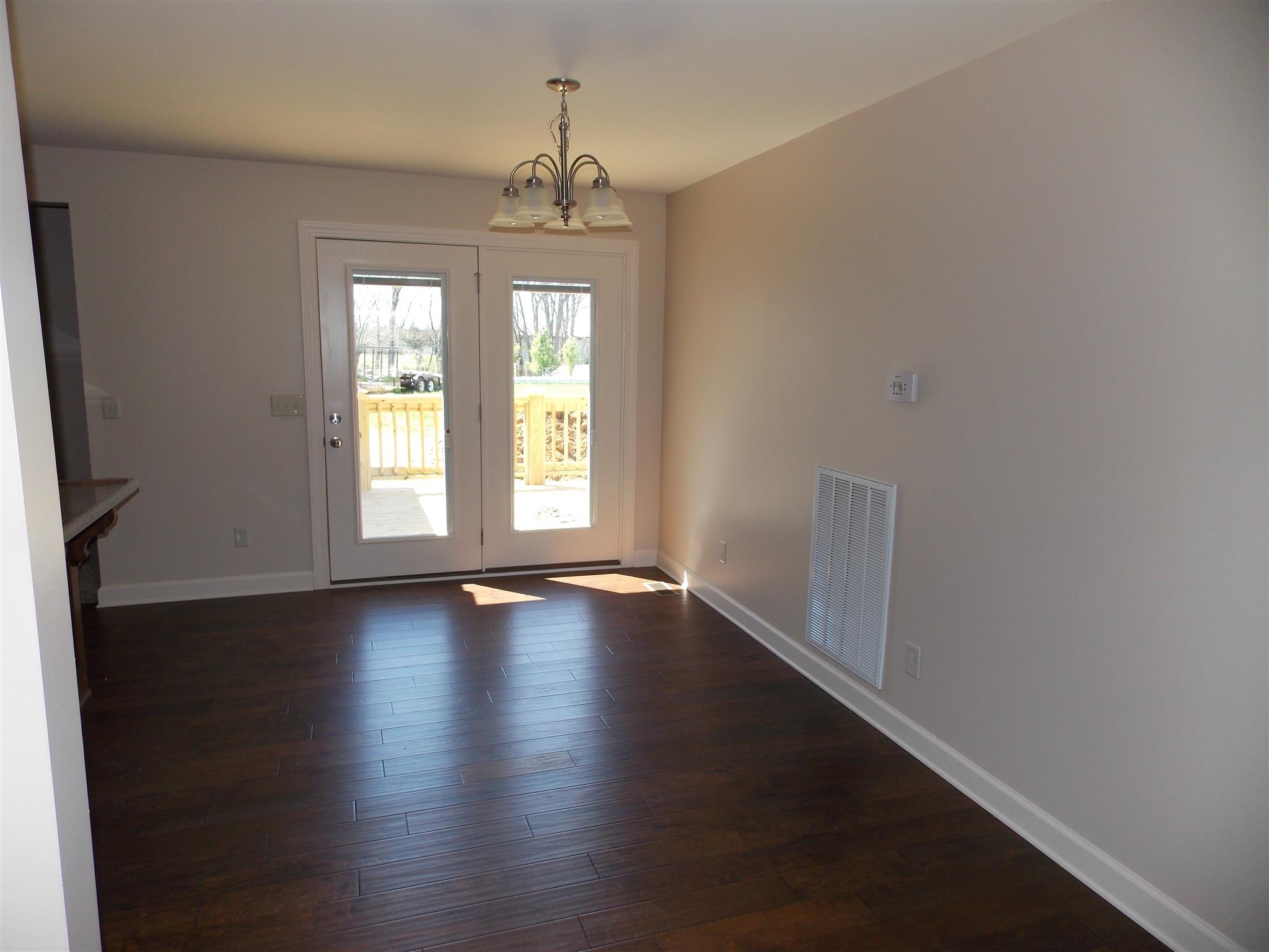 400 Goshen Road Lebanon, TN 37087 - Photo 14 of 20 an empty room with wooden floor and windows