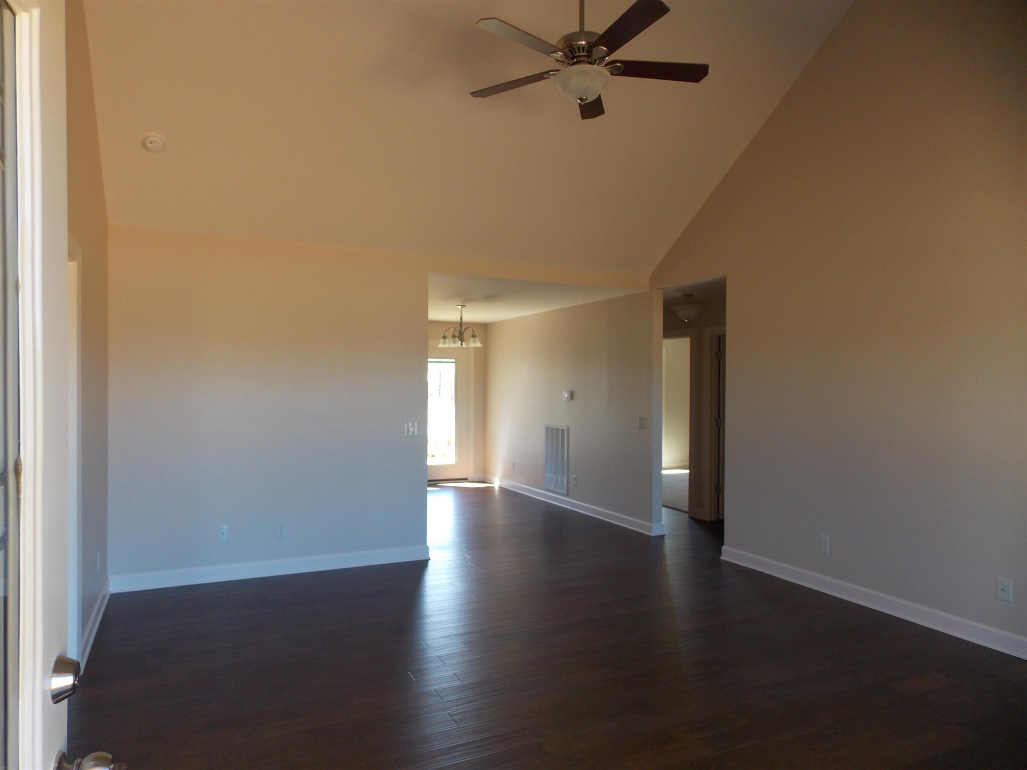 400 Goshen Road Lebanon, TN 37087 - Photo 4 of 20 a view of an empty room with a window and wooden floor