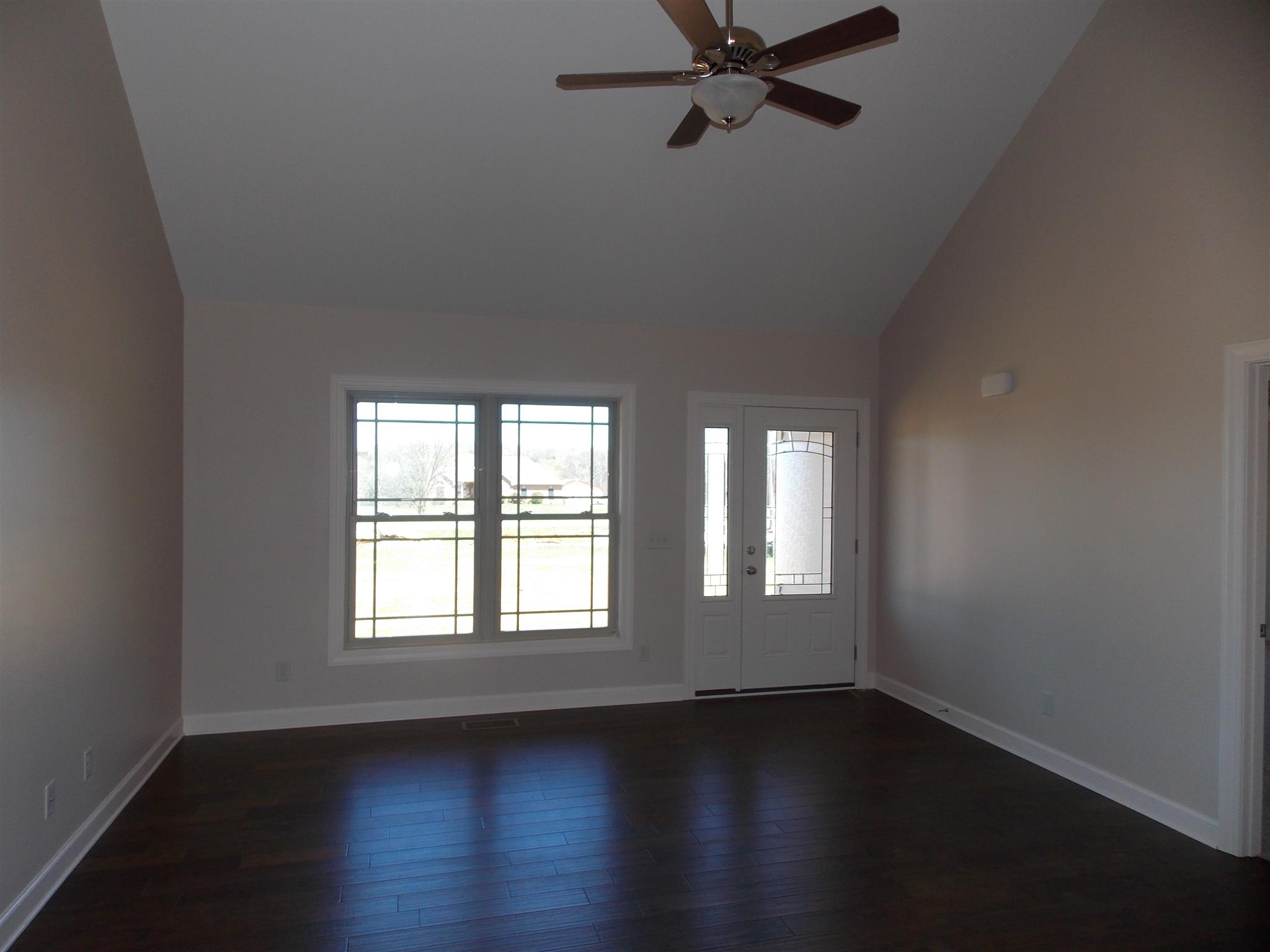 400 Goshen Road Lebanon, TN 37087 - Photo 10 of 20 a view of an empty room with wooden floor and a window