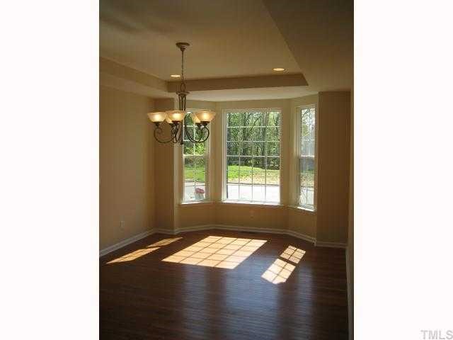 220 Forbes Road, Unit LOT13 Wake Forest, NC 27587 - Photo 5 of 12 Twin Angle Bay window / recessed cans / chandelier / trey ceiling / Hardwood floors