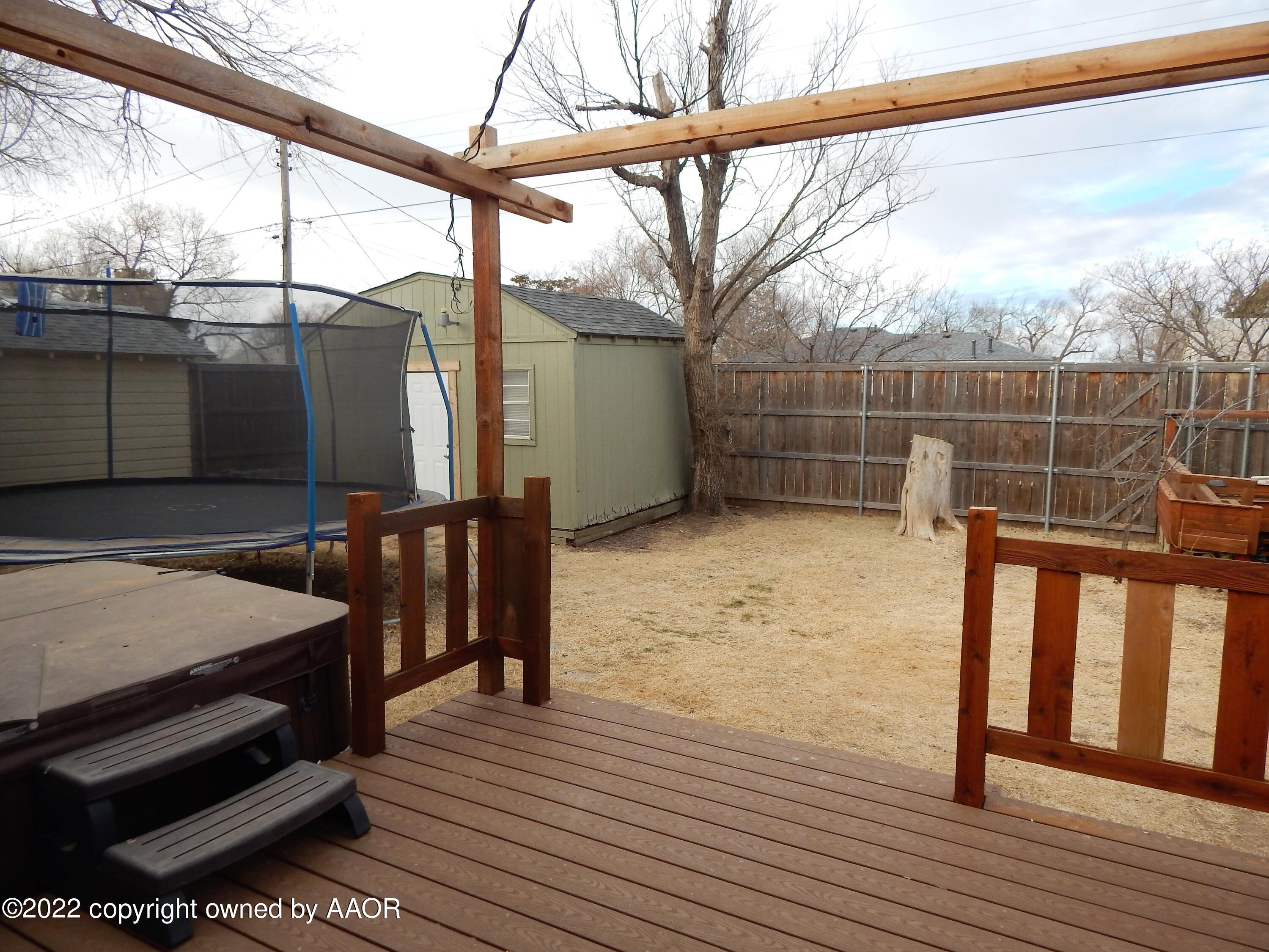 4202 South Lipscomb Street Amarillo, TX 79110 - Photo 18 of 25 a view of a balcony with wooden floor and iron stairs