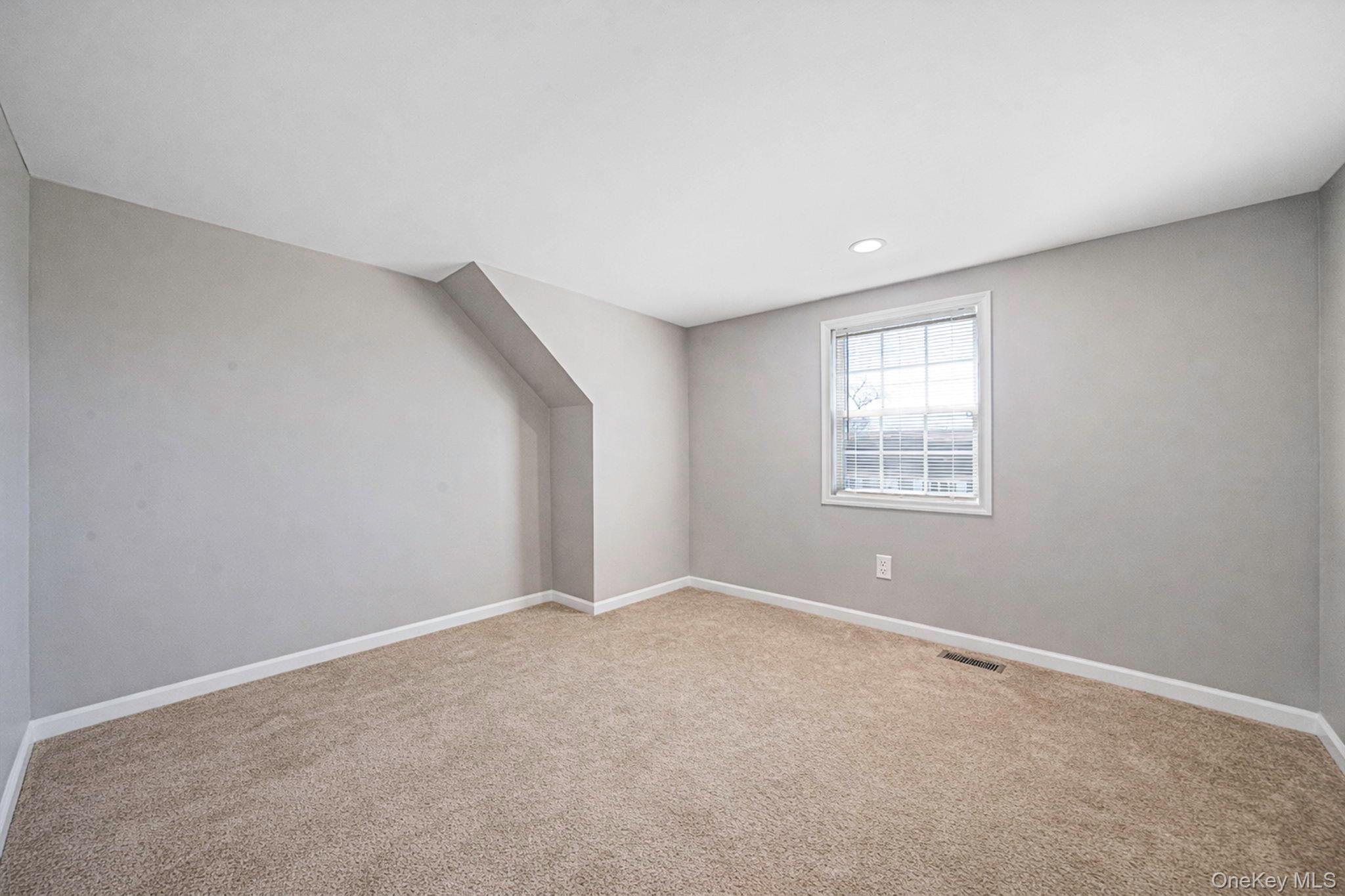 232 30th Street Lindenhurst, NY 11757 - Photo 11 of 46 an empty room with windows