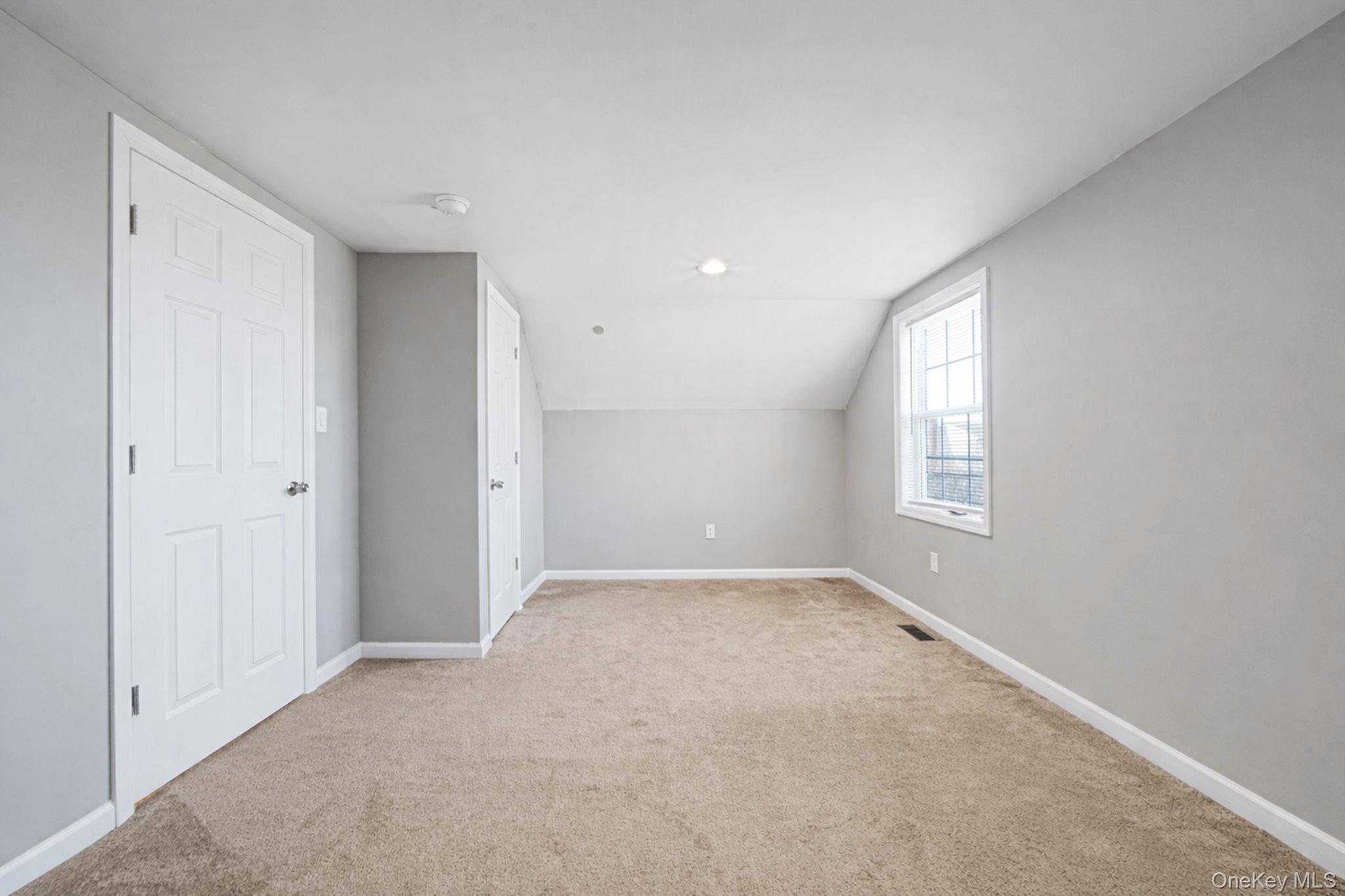 232 30th Street Lindenhurst, NY 11757 - Photo 15 of 46 an empty room with windows