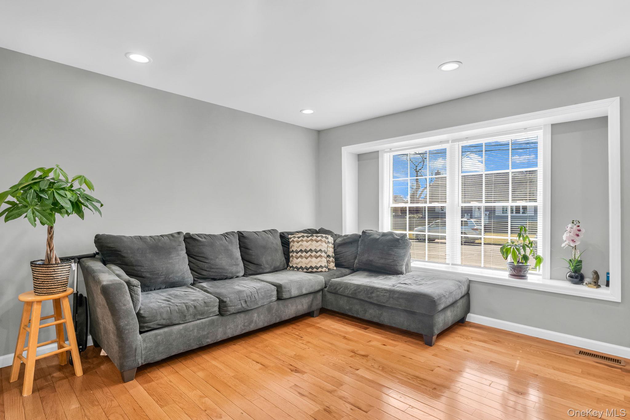 232 30th Street Lindenhurst, NY 11757 - Photo 22 of 46 a living room with furniture and a large window