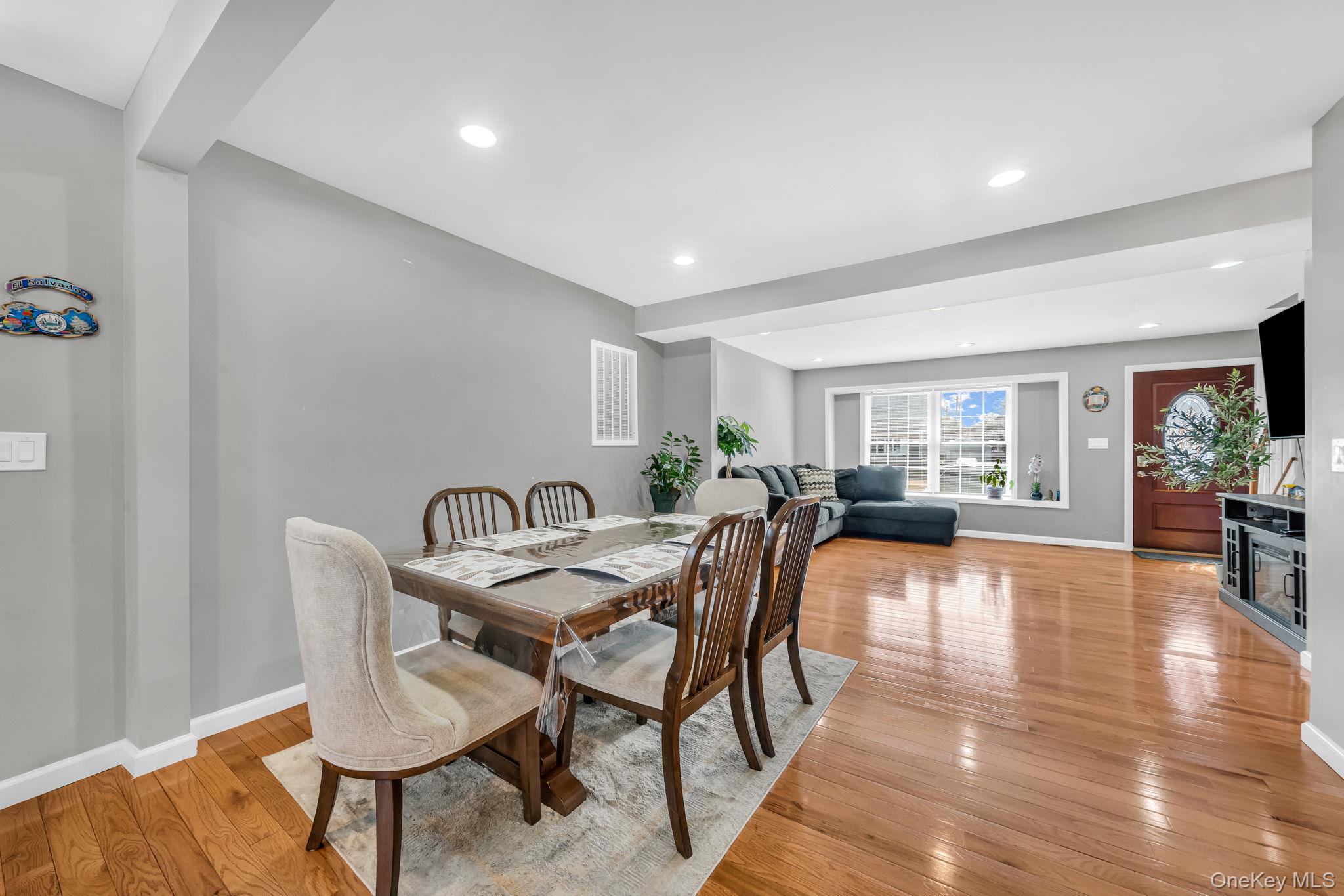 232 30th Street Lindenhurst, NY 11757 - Photo 25 of 46 a dining room with furniture and wooden floor