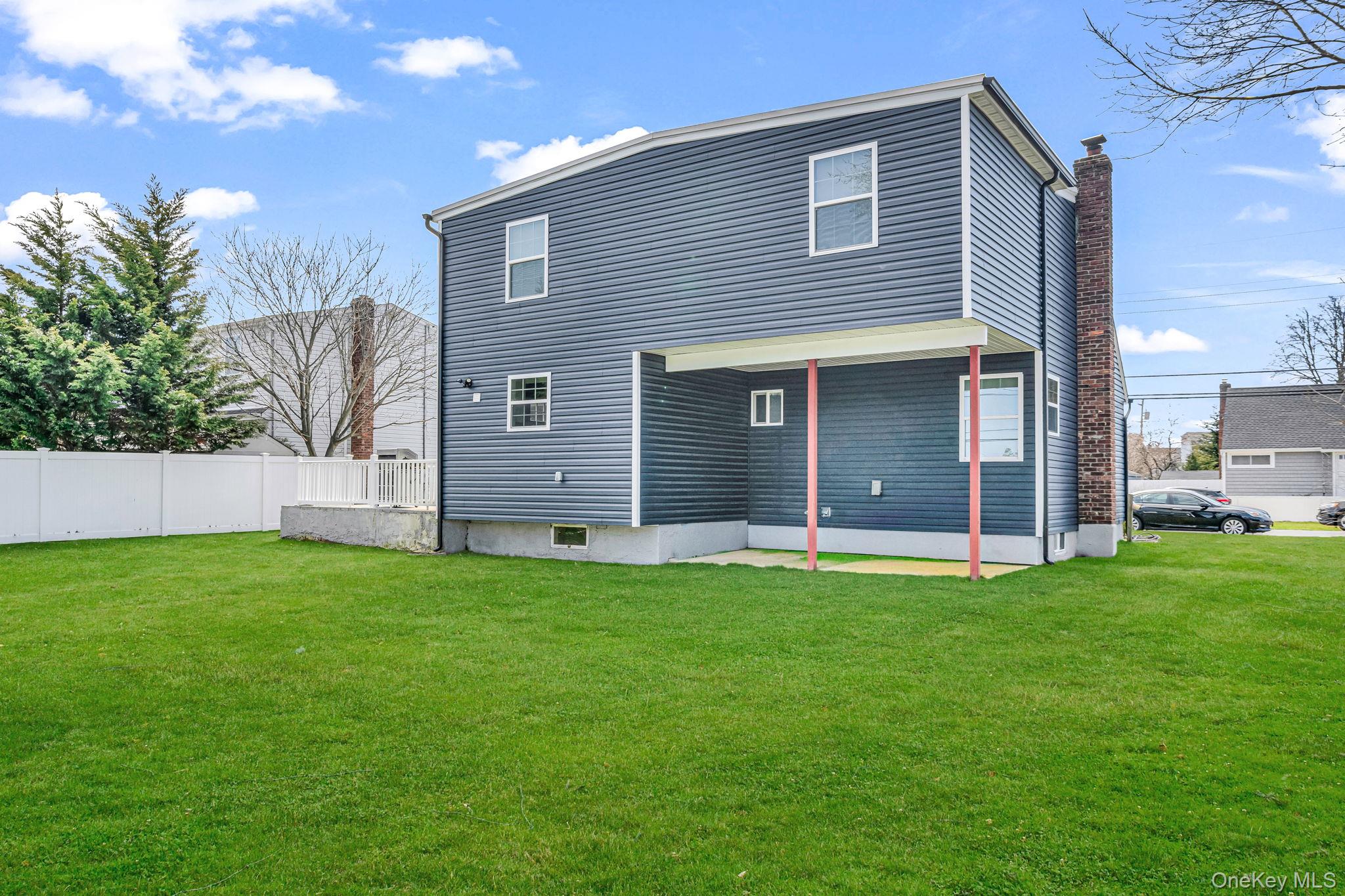 232 30th Street Lindenhurst, NY 11757 - Photo 36 of 46 a house that has a big yard and large trees