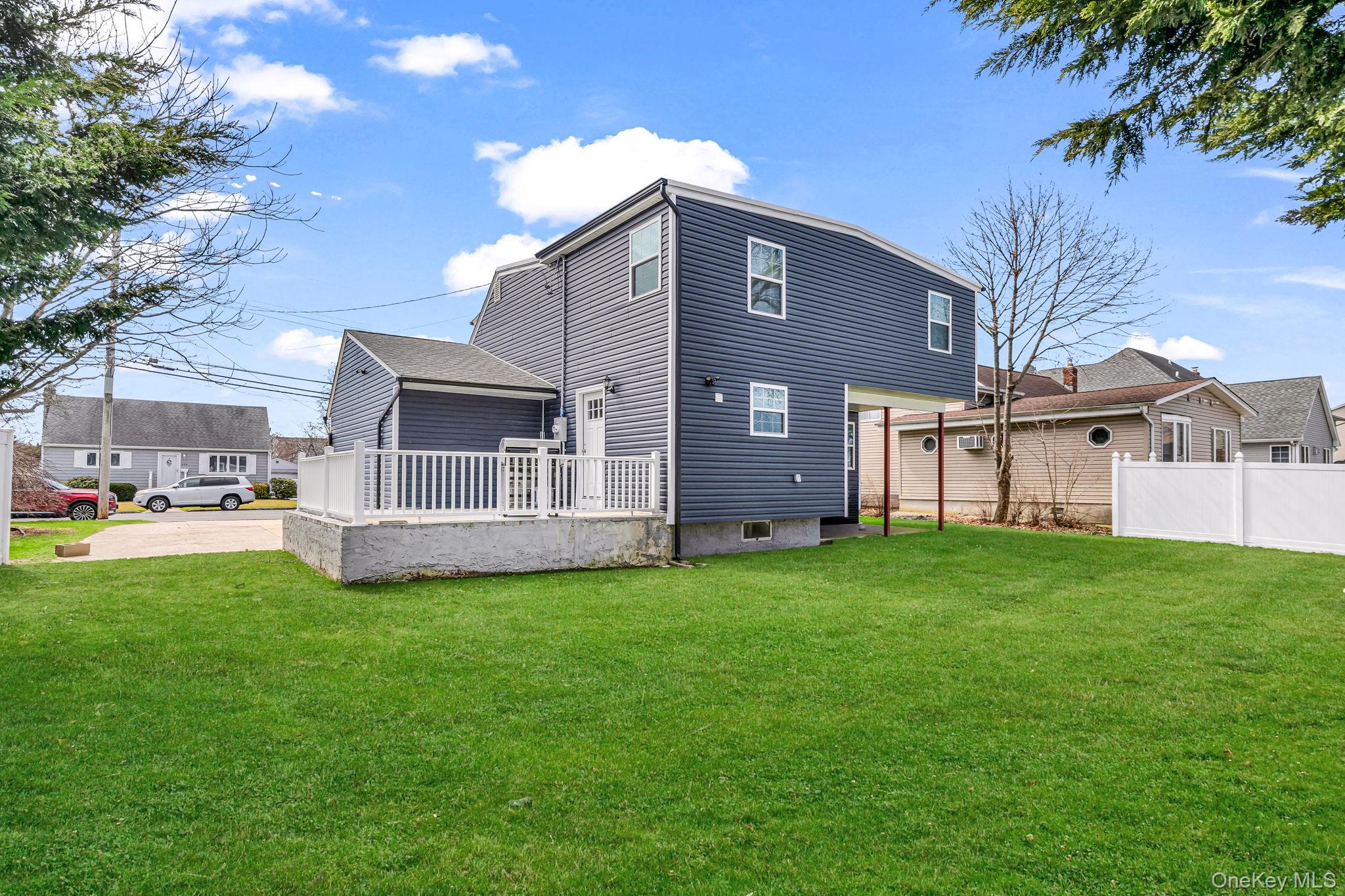 232 30th Street Lindenhurst, NY 11757 - Photo 38 of 46 a view of a house with a back yard