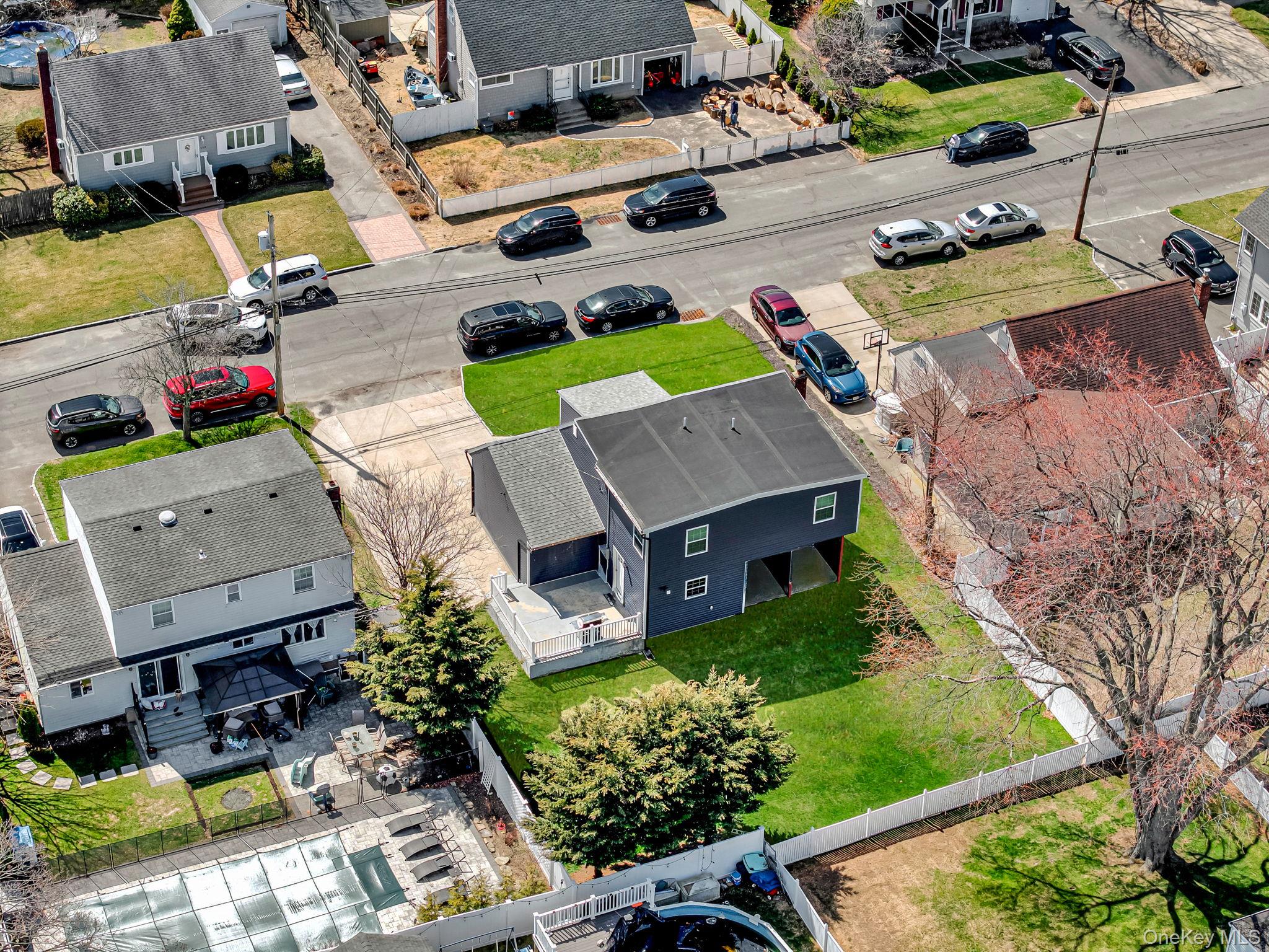 232 30th Street Lindenhurst, NY 11757 - Photo 41 of 46 an aerial view of a house with a garden
