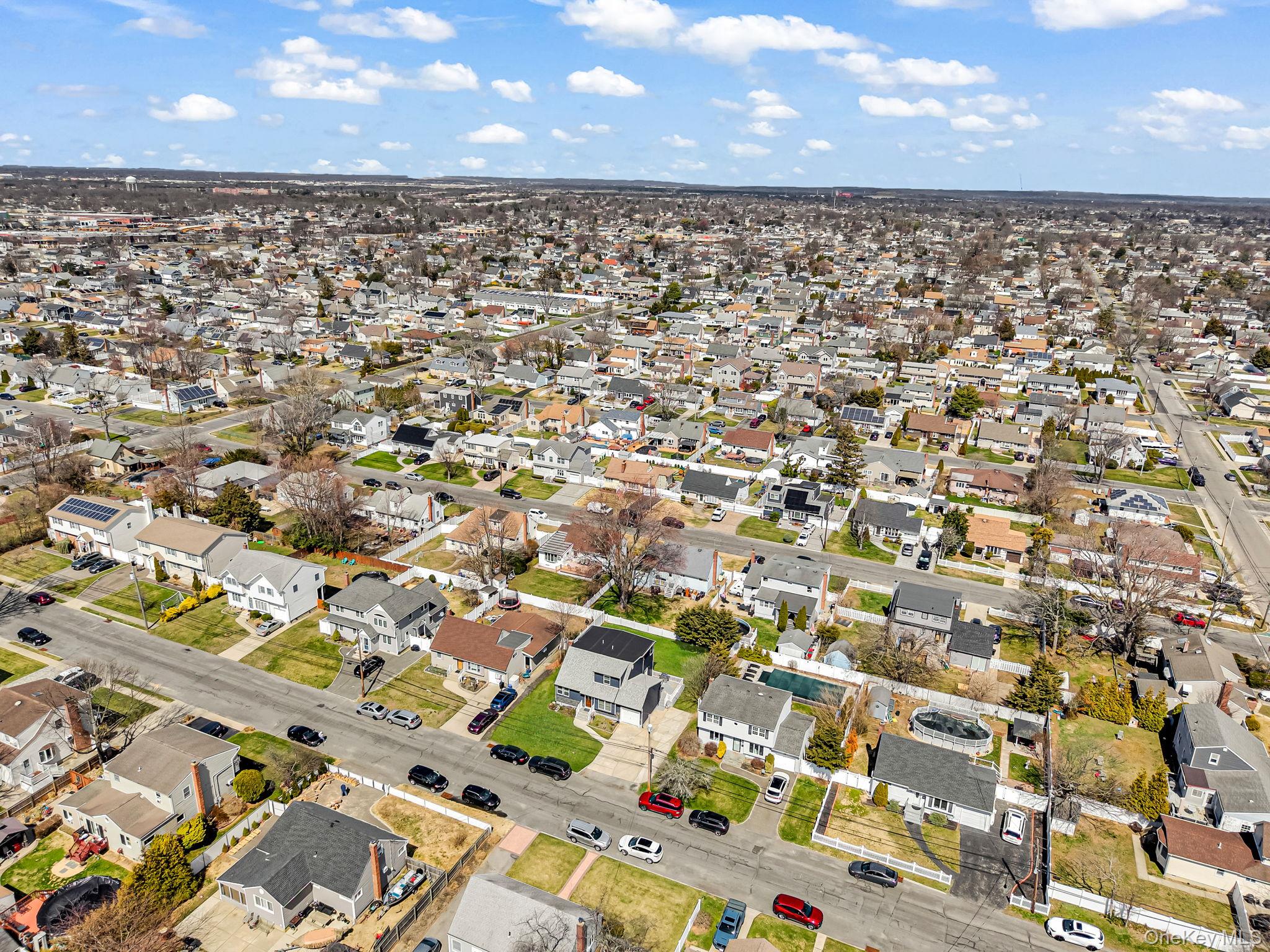 232 30th Street Lindenhurst, NY 11757 - Photo 43 of 46 an aerial view of residential houses with outdoor space