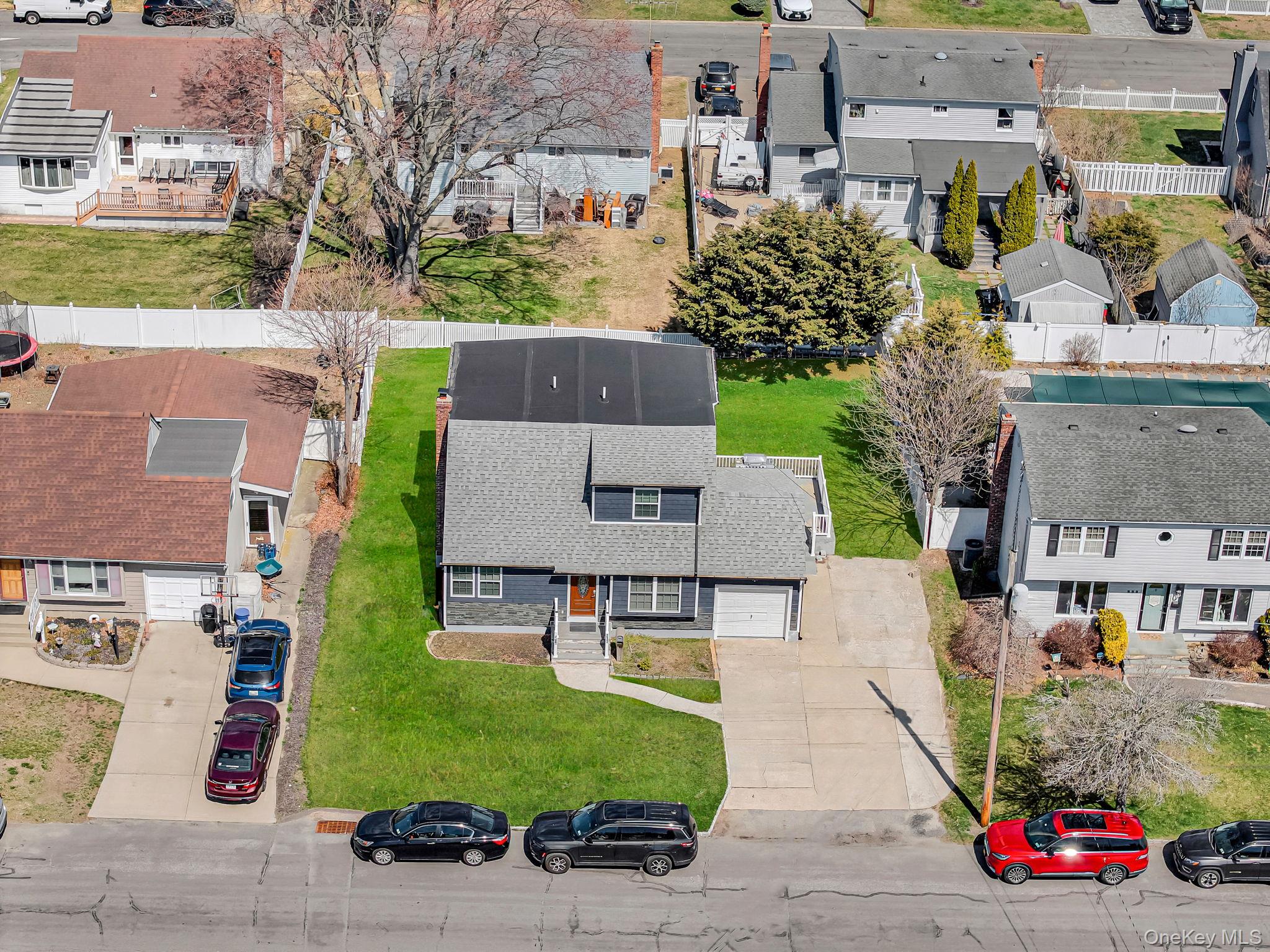 232 30th Street Lindenhurst, NY 11757 - Photo 44 of 46 an aerial view of multiple houses with yard