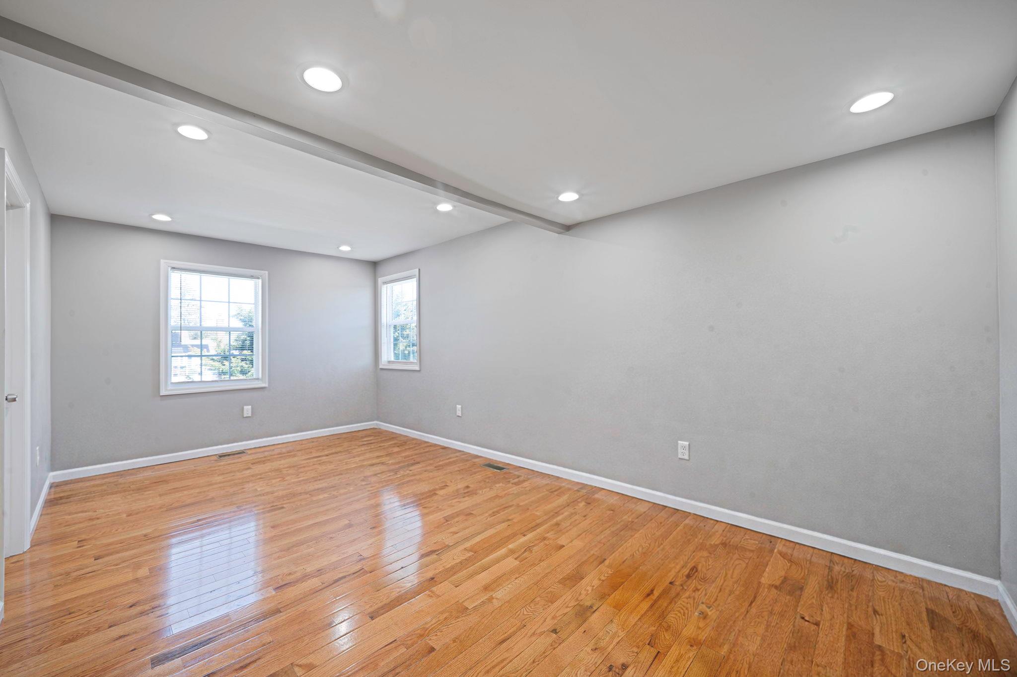 232 30th Street Lindenhurst, NY 11757 - Photo 9 of 46 an empty room with windows