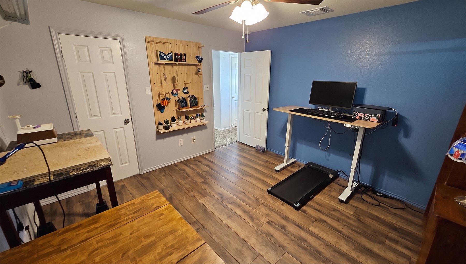 237 Bethann Drive Temple, TX 76502 - Photo 27 of 37 Spacious room featuring wood-finish flooring, a ceiling fan with integrated lighting, and a painted accent wall