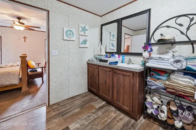 a view of kitchen island with furniture and wooden floor