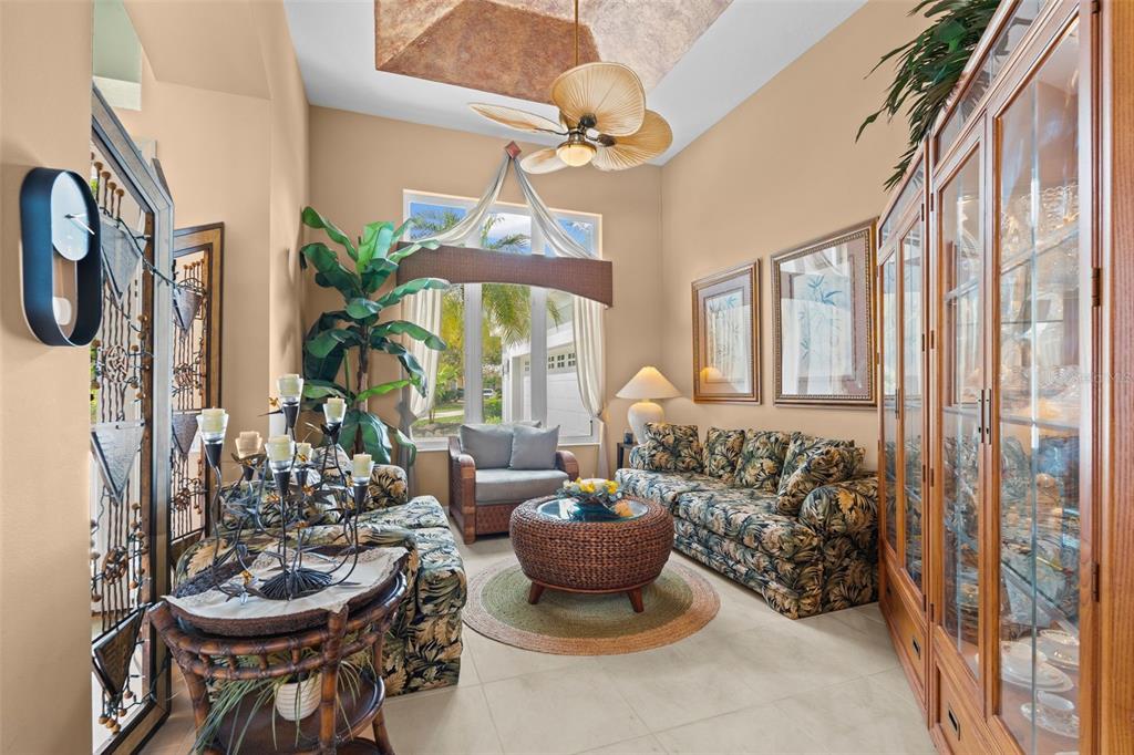 7517 Coventry Court Lakewood Ranch, FL 34202 - Photo 11 of 96 a living room with furniture and a chandelier