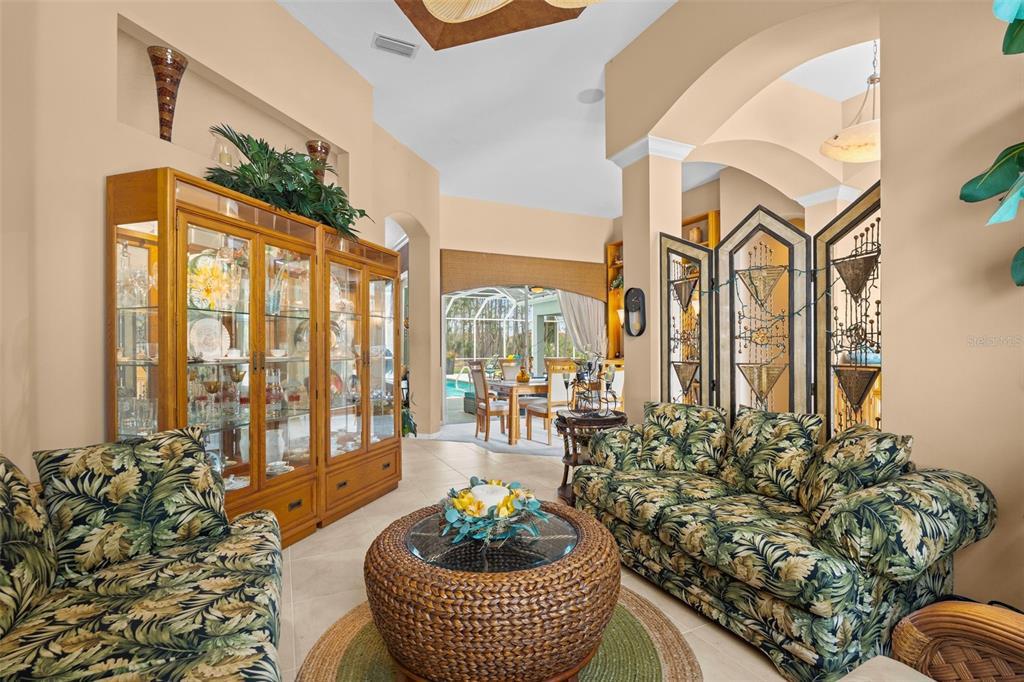 7517 Coventry Court Lakewood Ranch, FL 34202 - Photo 12 of 96 a living room with furniture and a potted plant