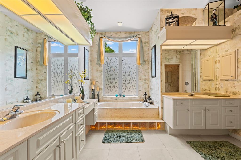 7517 Coventry Court Lakewood Ranch, FL 34202 - Photo 16 of 96 a spacious bathroom with a tub sink and mirror