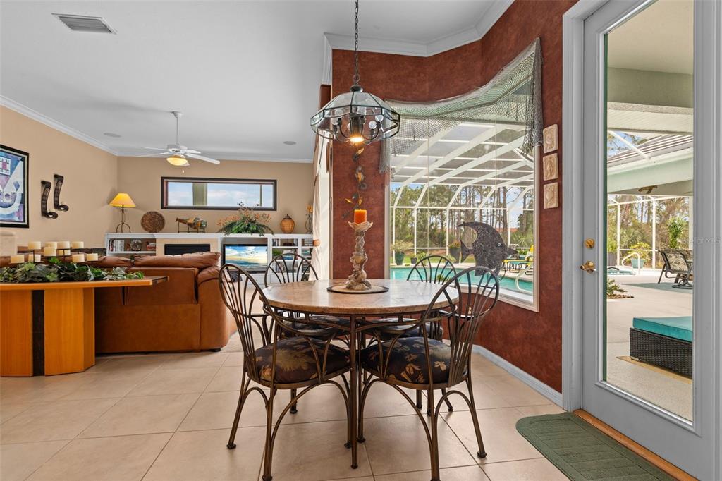 7517 Coventry Court Lakewood Ranch, FL 34202 - Photo 26 of 96 a view of a dining room with furniture window and outside view