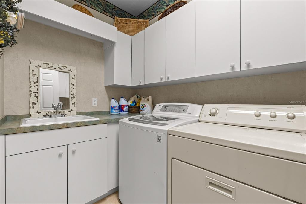 7517 Coventry Court Lakewood Ranch, FL 34202 - Photo 27 of 96 a utility room with dryer and washer