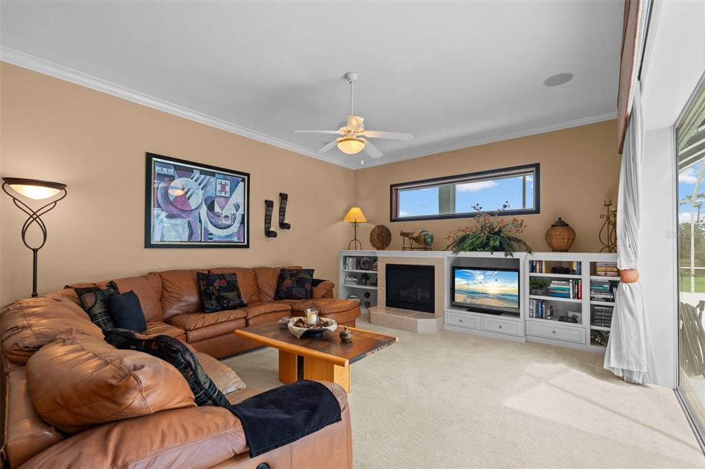 7517 Coventry Court Lakewood Ranch, FL 34202 - Photo 28 of 96 a living room with furniture and a flat screen tv