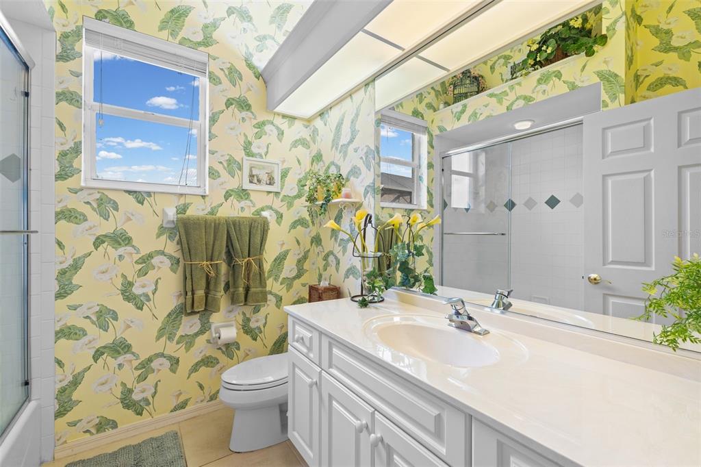 7517 Coventry Court Lakewood Ranch, FL 34202 - Photo 35 of 96 a bathroom with a sink a toilet and shower curtain