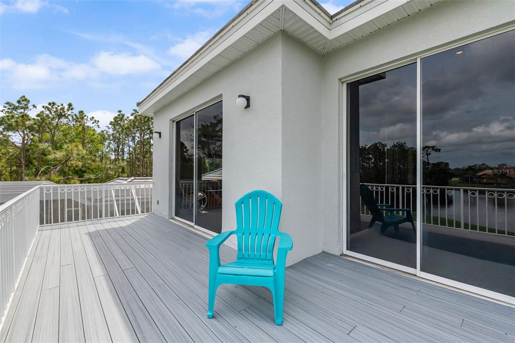 7517 Coventry Court Lakewood Ranch, FL 34202 - Photo 42 of 96 a view of a chair and table in the balcony