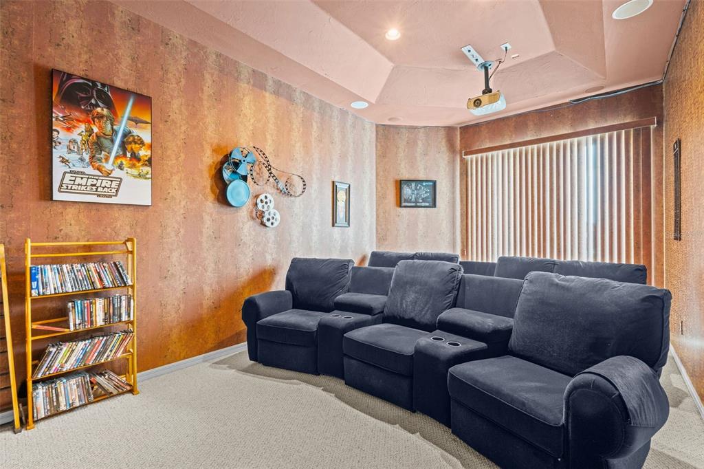 7517 Coventry Court Lakewood Ranch, FL 34202 - Photo 45 of 96 a blue couch sitting in a living room next to a window