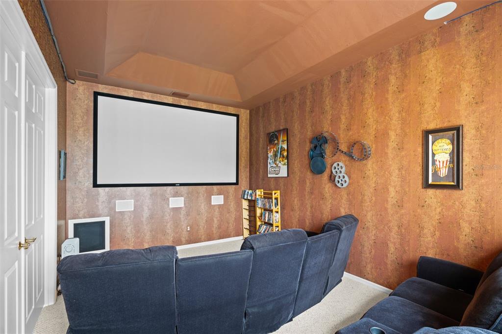 7517 Coventry Court Lakewood Ranch, FL 34202 - Photo 47 of 96 a living room with furniture and a flat screen tv