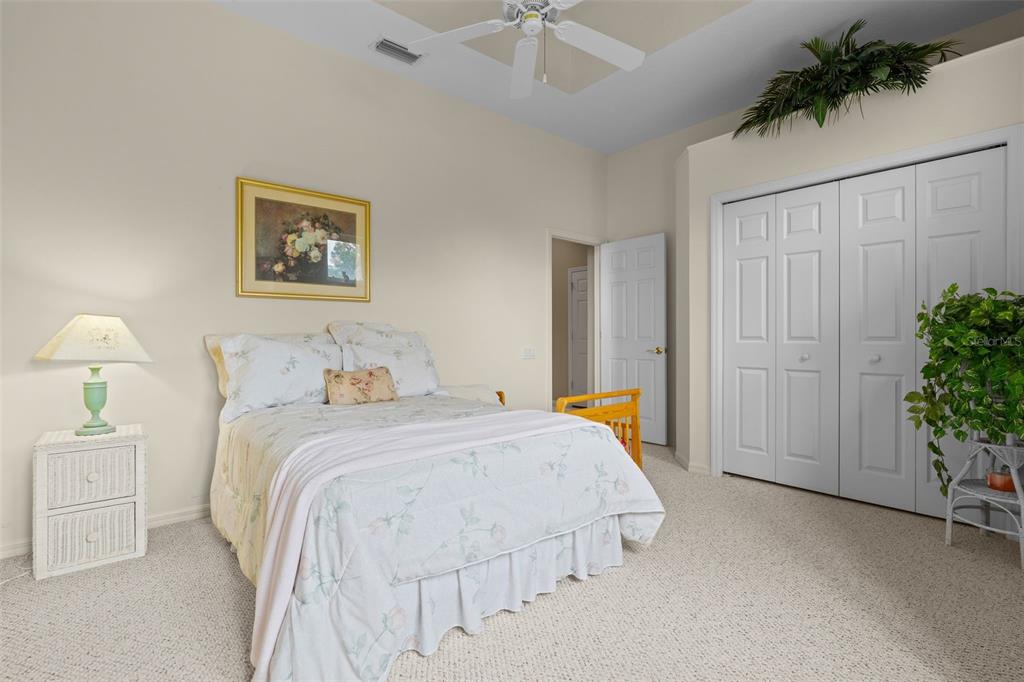 7517 Coventry Court Lakewood Ranch, FL 34202 - Photo 51 of 96 a bedroom with a bed and a table
