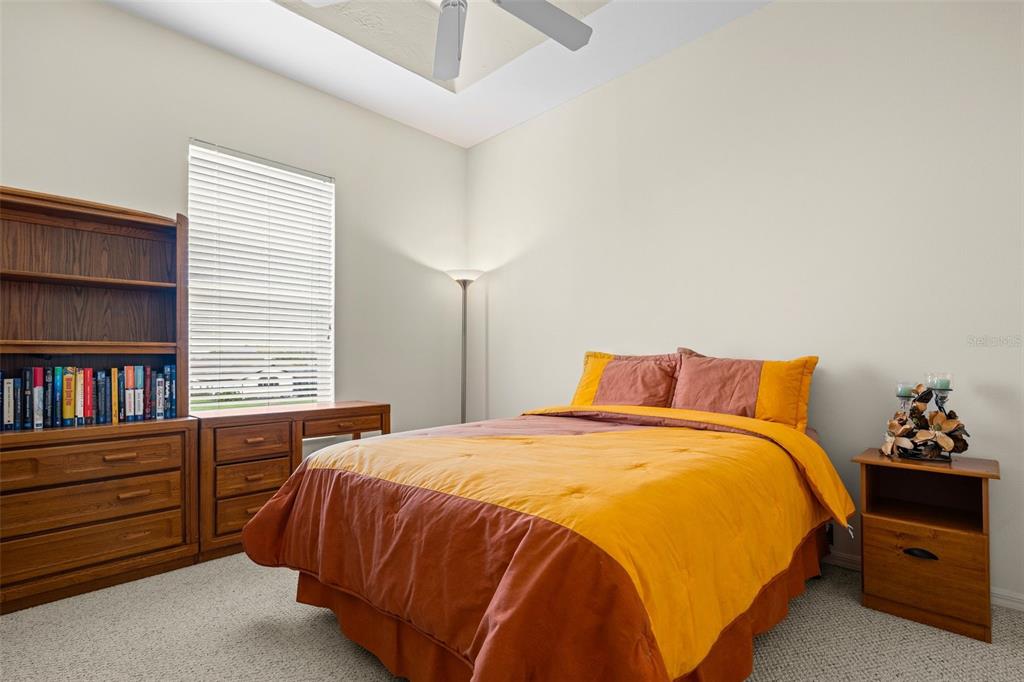 7517 Coventry Court Lakewood Ranch, FL 34202 - Photo 52 of 96 a bedroom with a bed and closet
