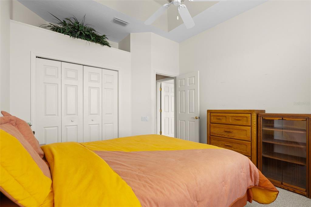 7517 Coventry Court Lakewood Ranch, FL 34202 - Photo 53 of 96 a bedroom with a bed and dresser