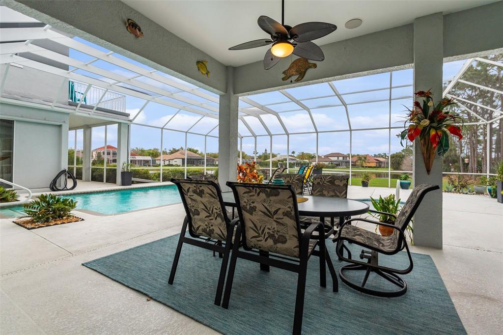 7517 Coventry Court Lakewood Ranch, FL 34202 - Photo 63 of 96 a view of a dining room with furniture window and outside view