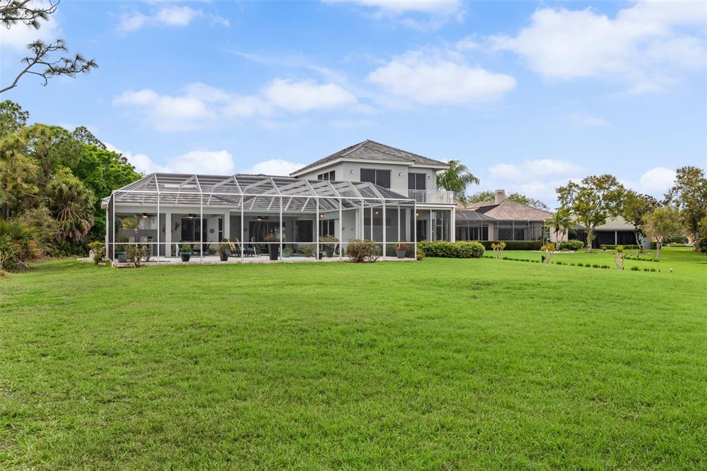 7517 Coventry Court Lakewood Ranch, FL 34202 - Photo 72 of 96 a front view of a building with a garden