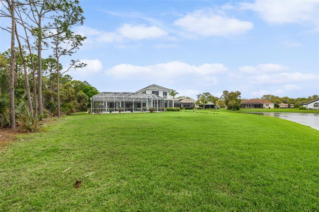 7517 Coventry Court Lakewood Ranch, FL 34202 - Photo 73 of 96 a view of a garden with a house