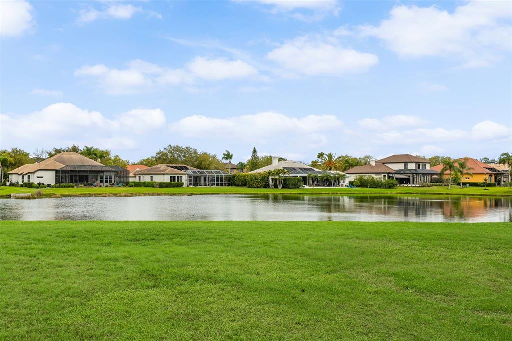 7517 Coventry Court Lakewood Ranch, FL 34202 - Photo 74 of 96 a view of a lake with houses in the background