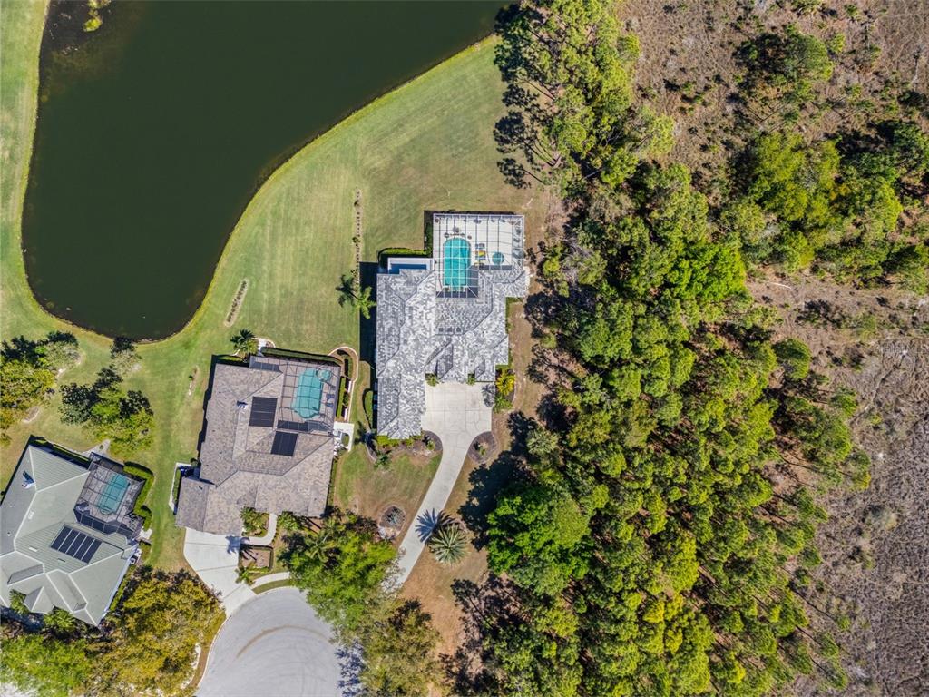 7517 Coventry Court Lakewood Ranch, FL 34202 - Photo 79 of 96 an aerial view of a house with a yard and wooden floor