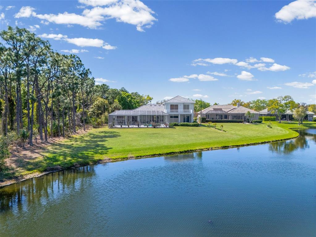 7517 Coventry Court Lakewood Ranch, FL 34202 - Photo 84 of 96 a view of a lake with houses in the background