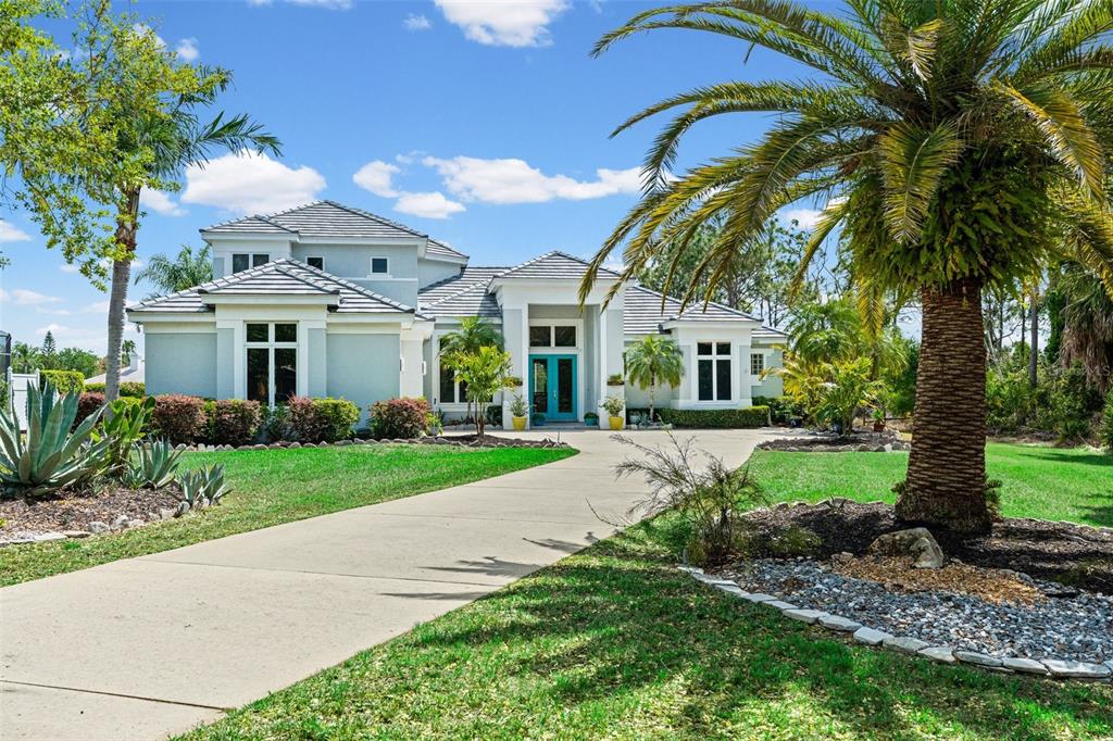 7517 Coventry Court Lakewood Ranch, FL 34202 - Photo 92 of 96 a front view of a house with garden