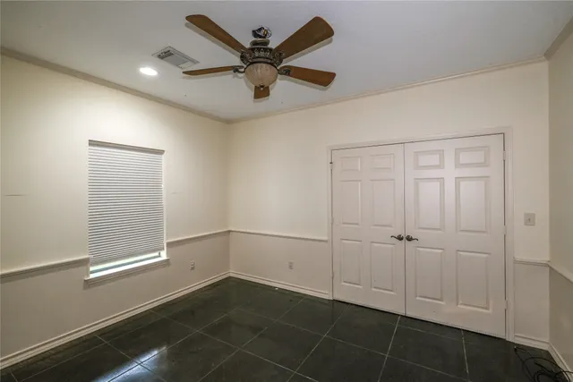 a large bathroom with a granite countertop sink and a mirror