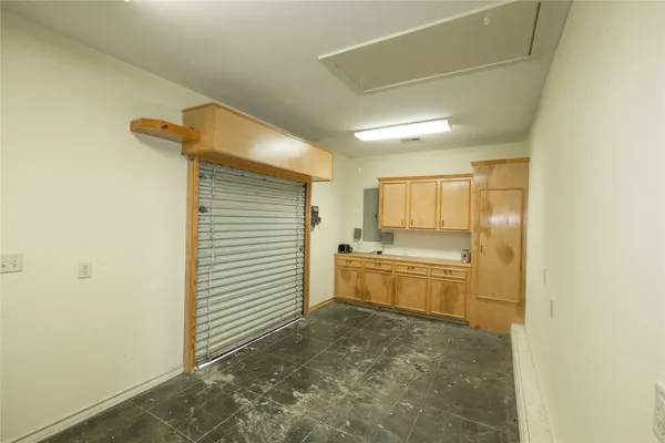 a large bathroom with a granite countertop sink and a mirror