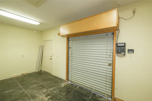 a path view of a house with brick walls