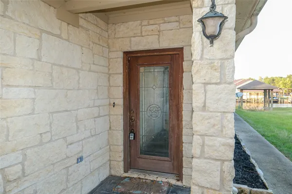 a bathroom with a shower and a mirror
