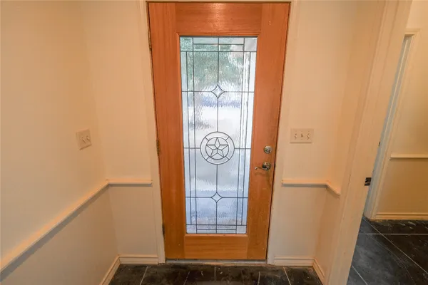 a view of door with wooden floor