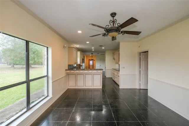 a view of a kitchen with a sink and a window
