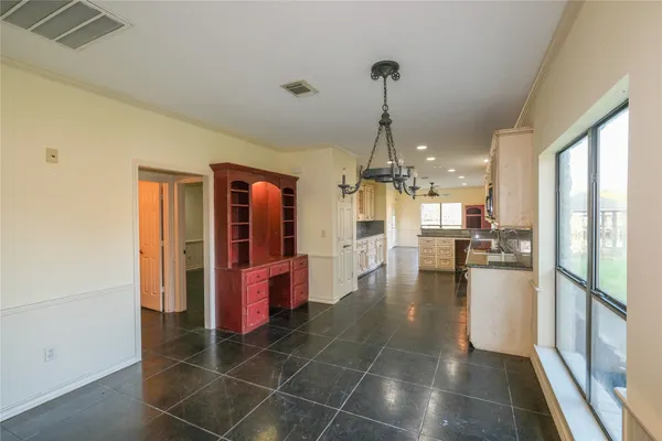 a kitchen with stainless steel appliances a refrigerator and microwave