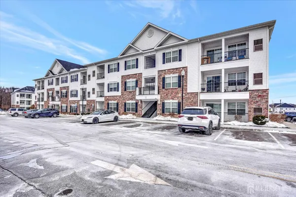 a buildings with car parked in front of it