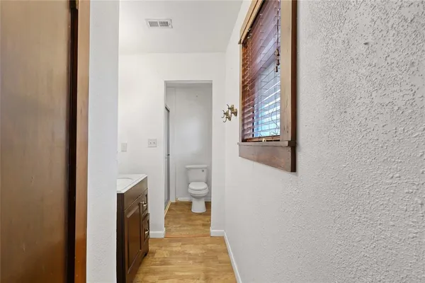 a view of a bathroom from the hallway