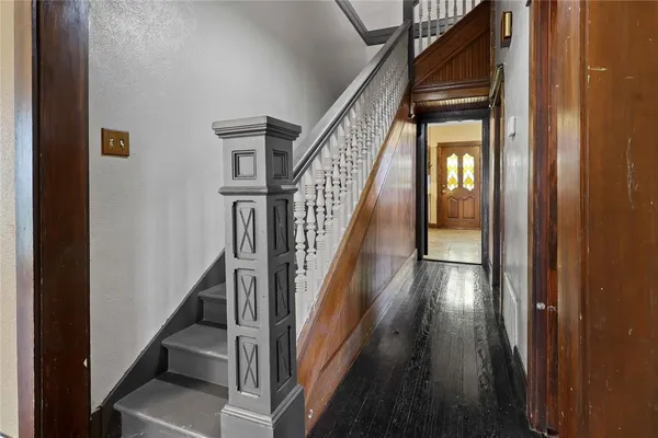 a view of staircase with wooden floor and staircase