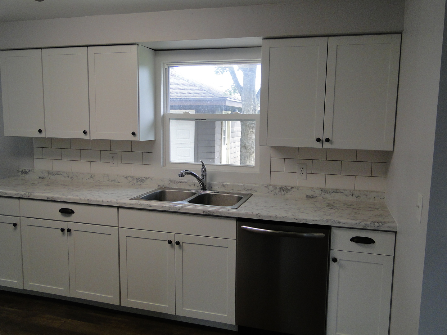 839 County Rd S 419 East Kankakee, IL 60901 - Photo 7 of 20 a kitchen with white cabinets and a window