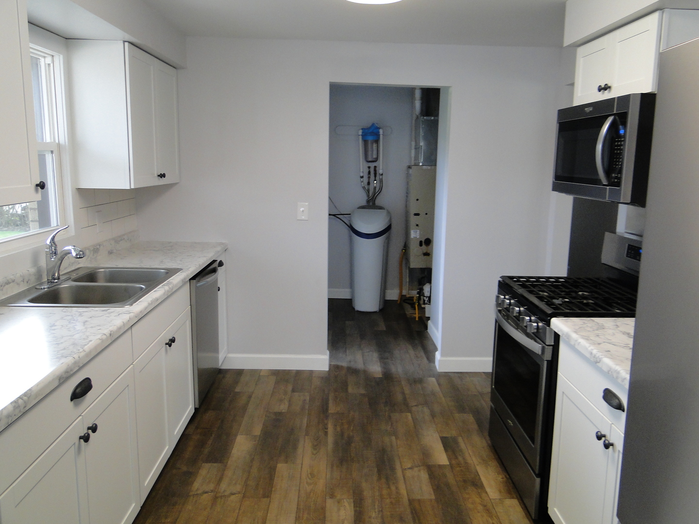 839 County Rd S 419 East Kankakee, IL 60901 - Photo 9 of 20 a kitchen with granite countertop a sink stove and refrigerator